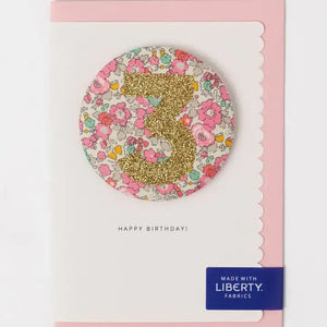Liberty birthday badge age 3 in Besty Ann pale pink with glittery number on a charming portrait card. Perfect for a third celebration!