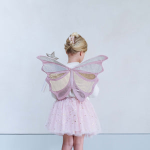 Little girl wearing Mimi & Lula Emmelina Fairy Wings in pink and a sparkly tutu, viewed from the back.