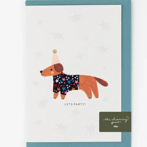 Charming A6 birthday card featuring a sausage dog in a Liberty fabric coat, celebrating with a party hat and "Lets Party!" message.